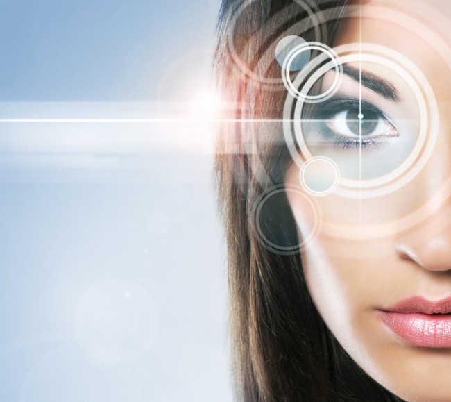 Close-up portrait of a woman with a virtual hologram on her eyes (future of skin care concept).