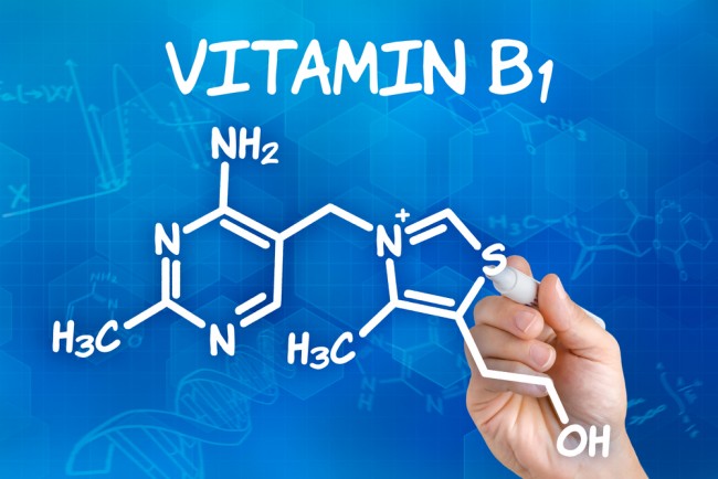 Image of a pen drawing the chemical formula of Vitamin B1. 
