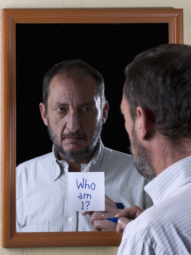 Mirror reflection of a man suffering from Alzheimer's disease