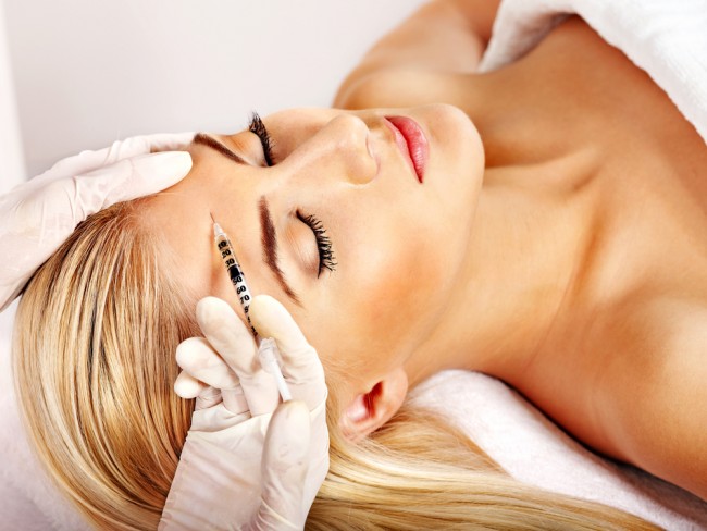 Woman getting a Botox treatment. 