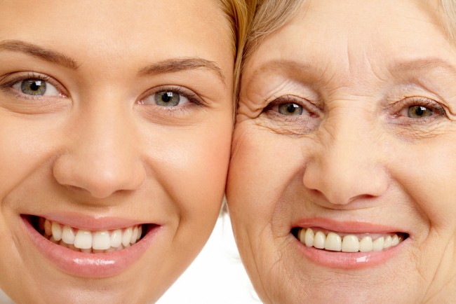 Closeup of the faces of a mother and daughter to highlight skin aging.