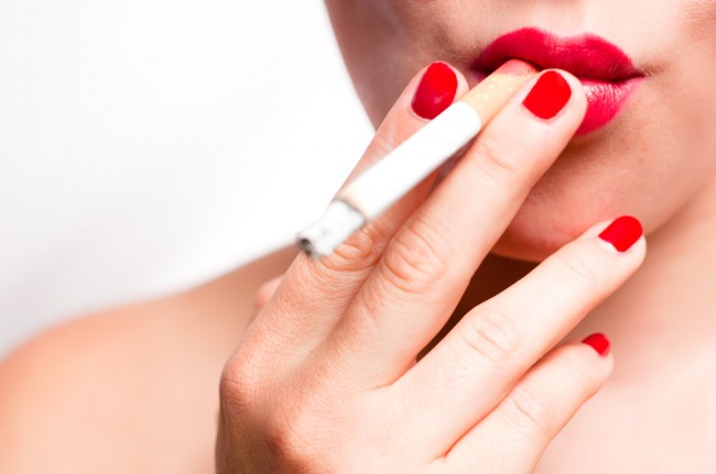 Closeup of a woman smoking a cigarette.