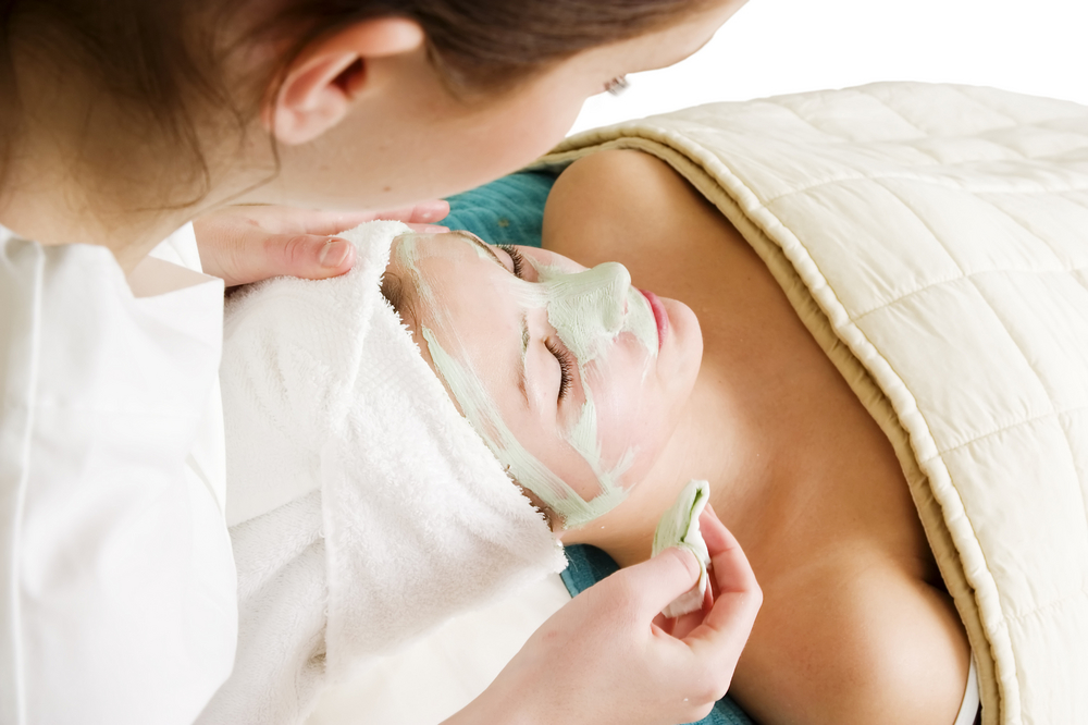 Woman getting a facial treatment. 