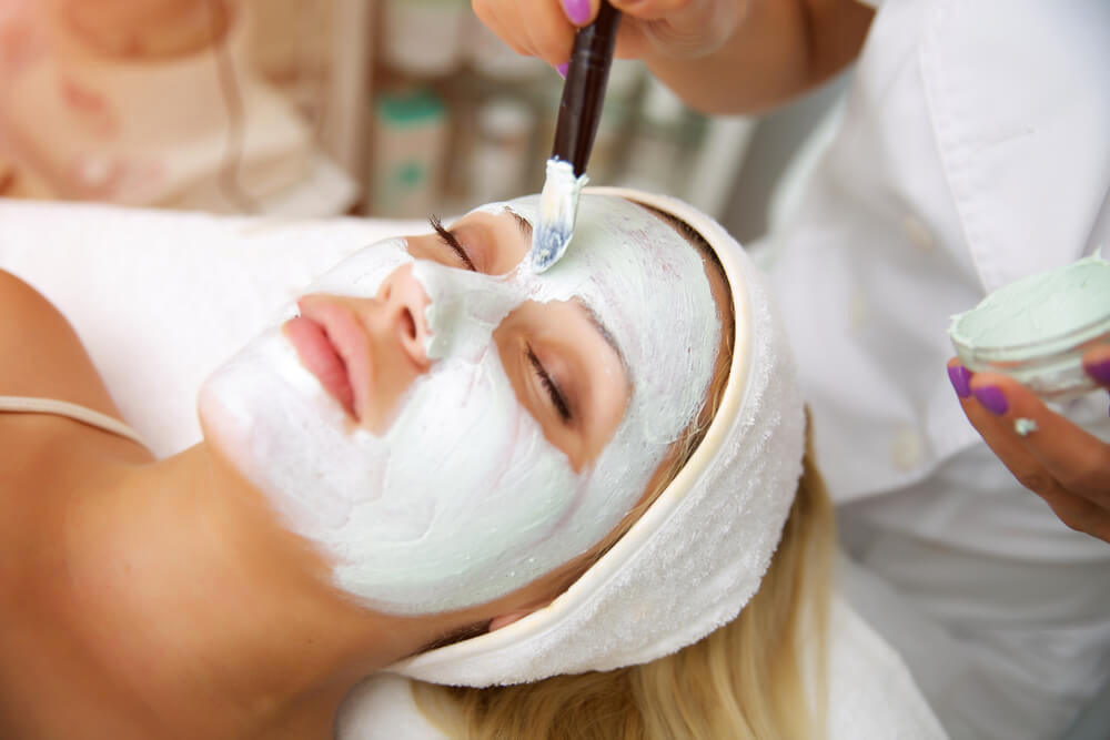 Young woman enjoying a face mask treatment