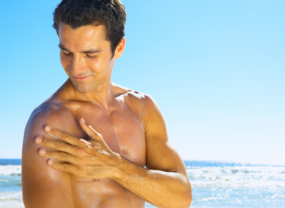 Man applying sunscreen