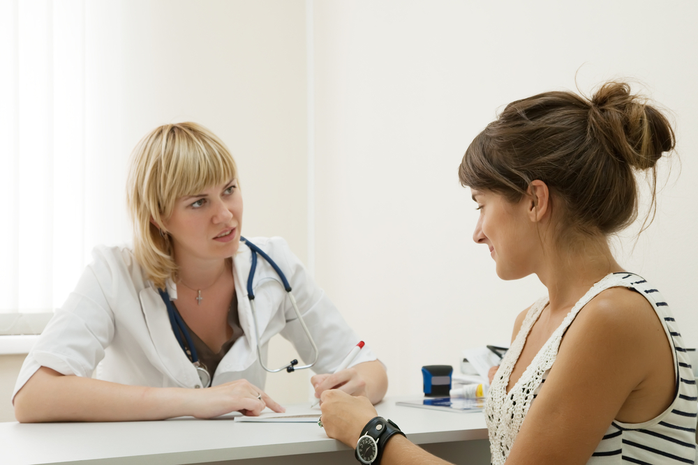 woman speaking with doctor