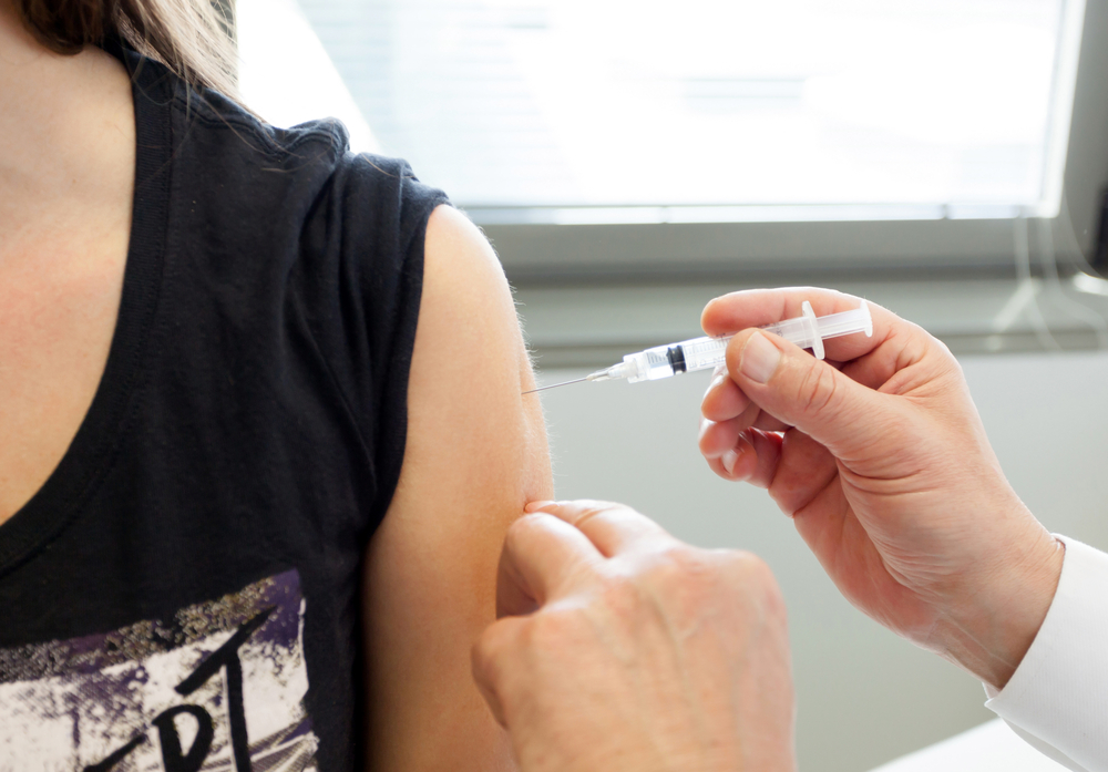 Woman getting a tetanus injection