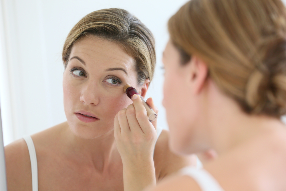 Woman looking at eye wrinkles