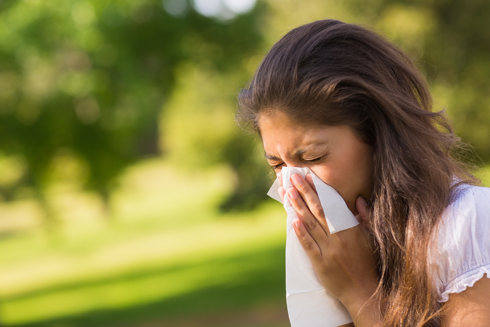 Woman sneezing