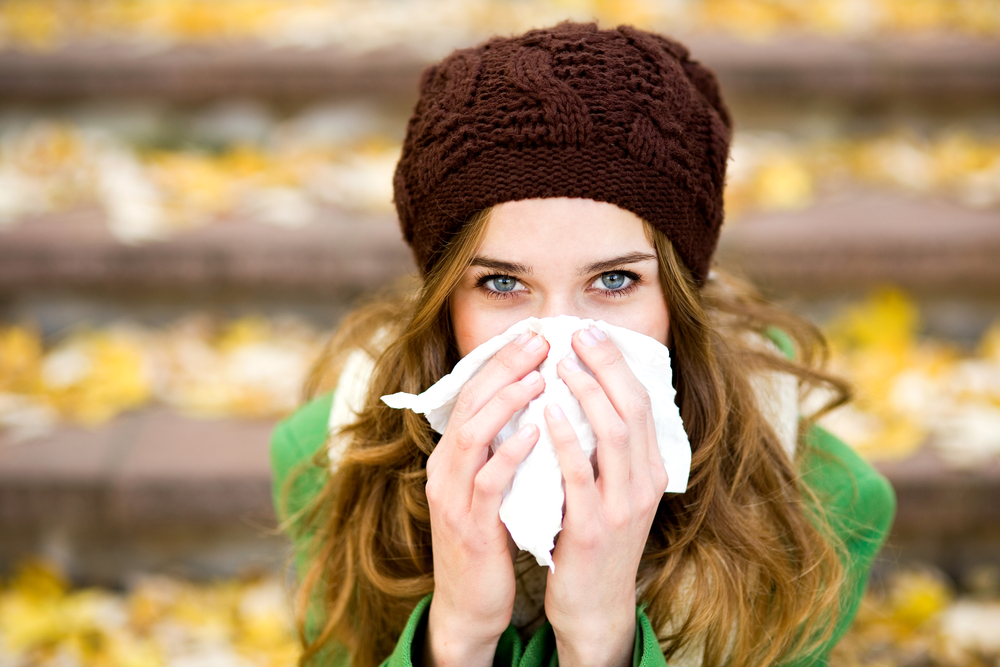 Woman sneezing