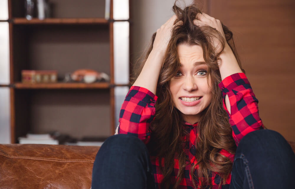 Stressed woman holding her hair