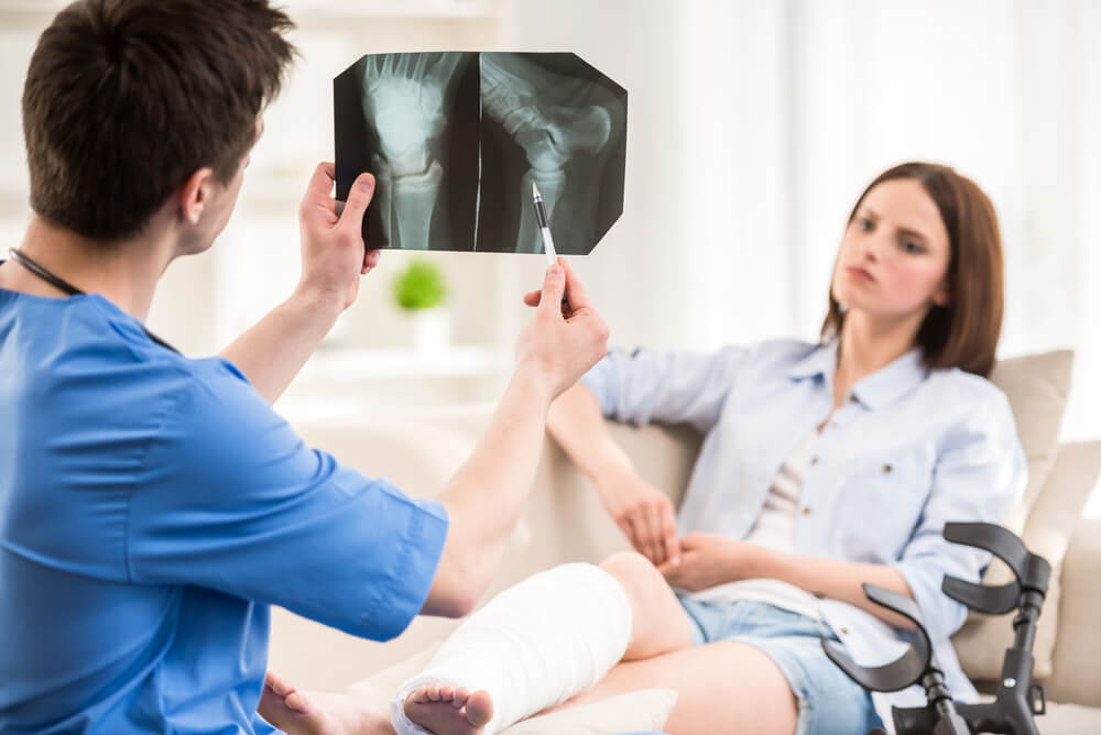 Physiatrist telling his patient about her bone condition