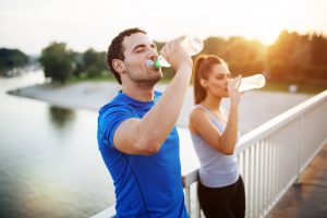 couple drinking water during a workout