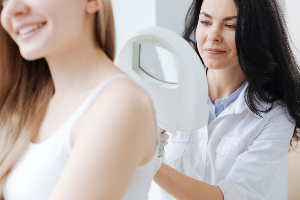 woman getting a skin check at the dermatologist's