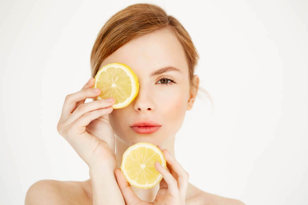 woman with citrus slices