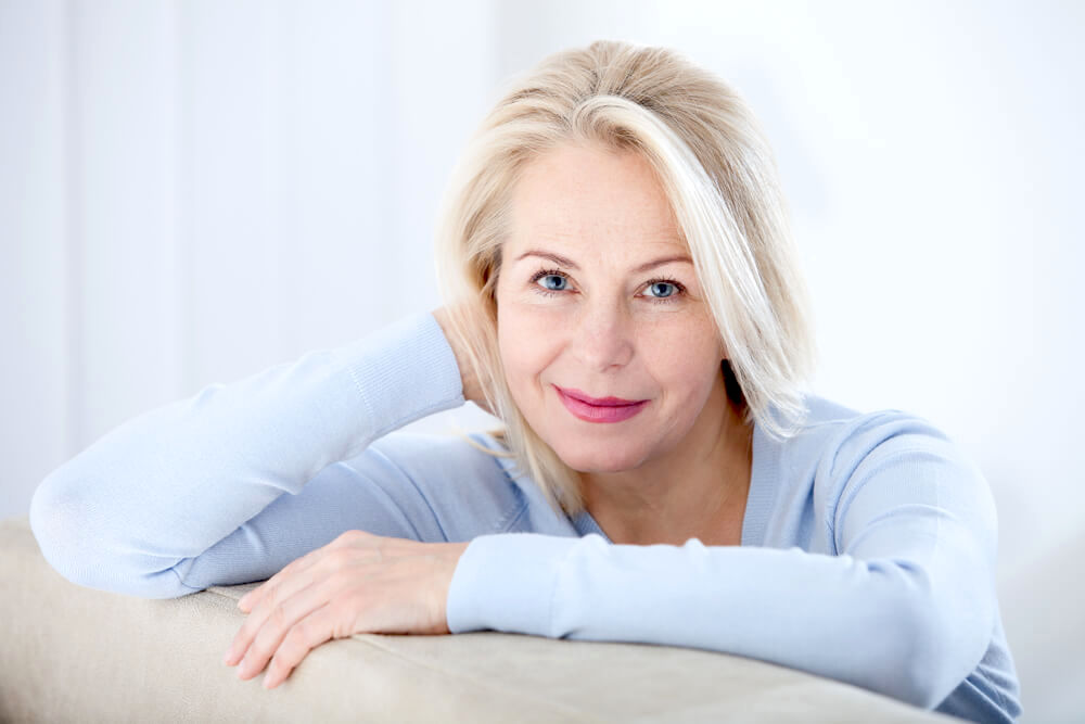 Mature beautiful woman resting and smiling. 