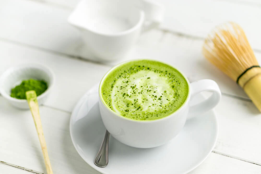 Matcha green tea on white table